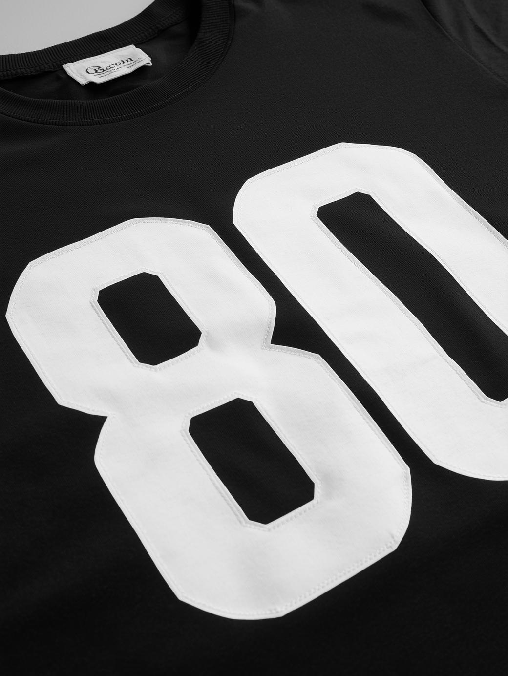 regular black t shirt with large 80 on the front in white lettering